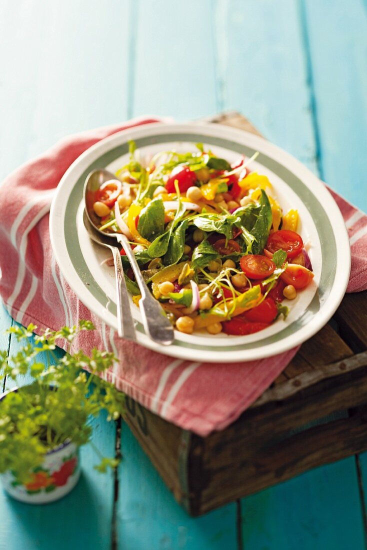 A colourful salad with peppers and chickpeas
