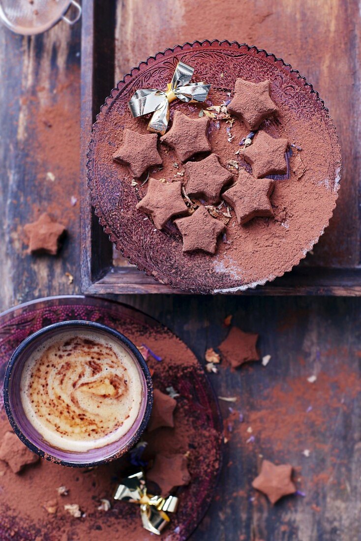 Star-shaped chocolate truffles with almonds and cocoa powder