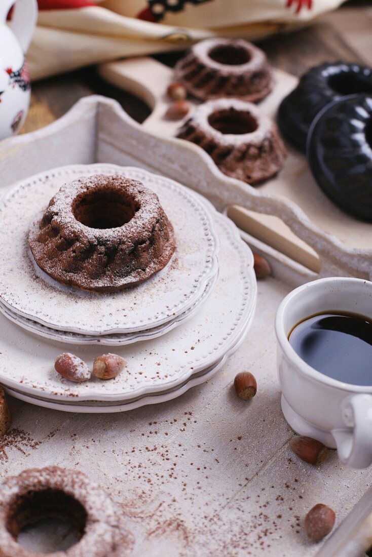 Freshly baked chocolate and hazelnut Bundt cakes sprinkled with icing sugar and cinnamon for Easter