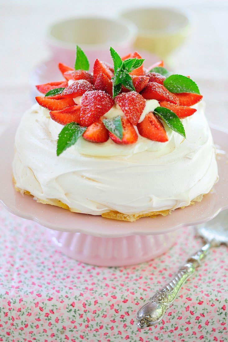 Strawberry pavlova on a cake stand