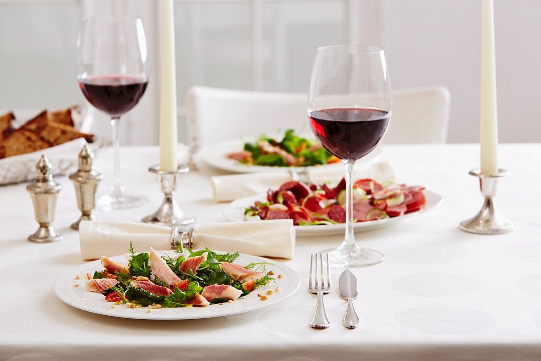 Smoked trout with a wild herb salad served with red wine