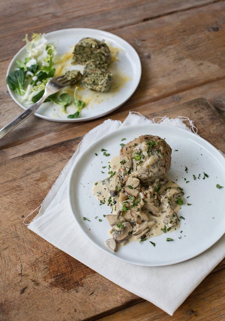 Spinach and bacon dumplings with a mushroom sauce