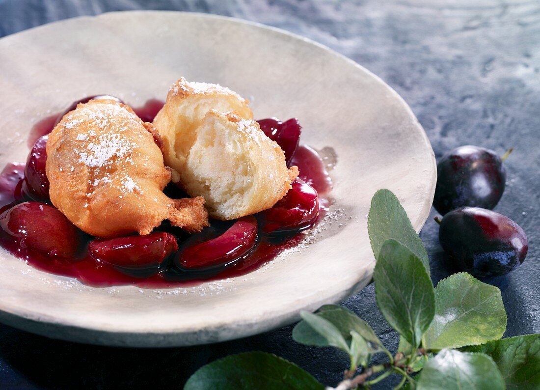 Mutzen (Karneval pastry from the Rhineland, Germany) in plum compote