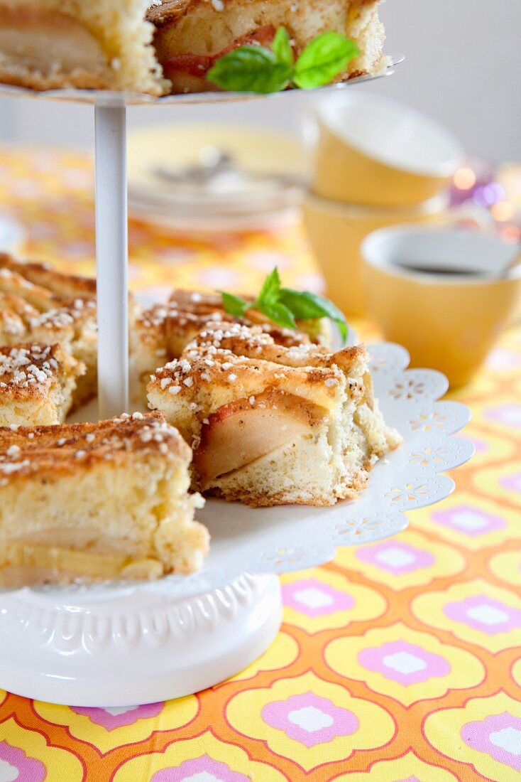 Slices of apple tray bake cake on a cake stand