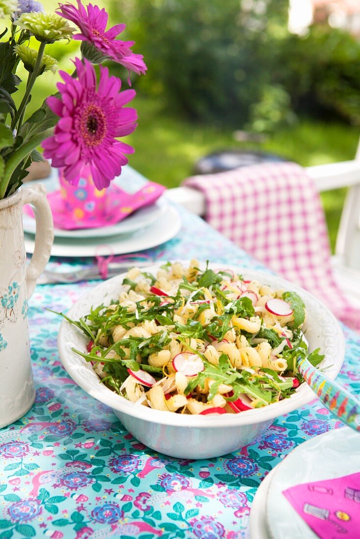 Pasta salad with radishes, rocket and lemon zest