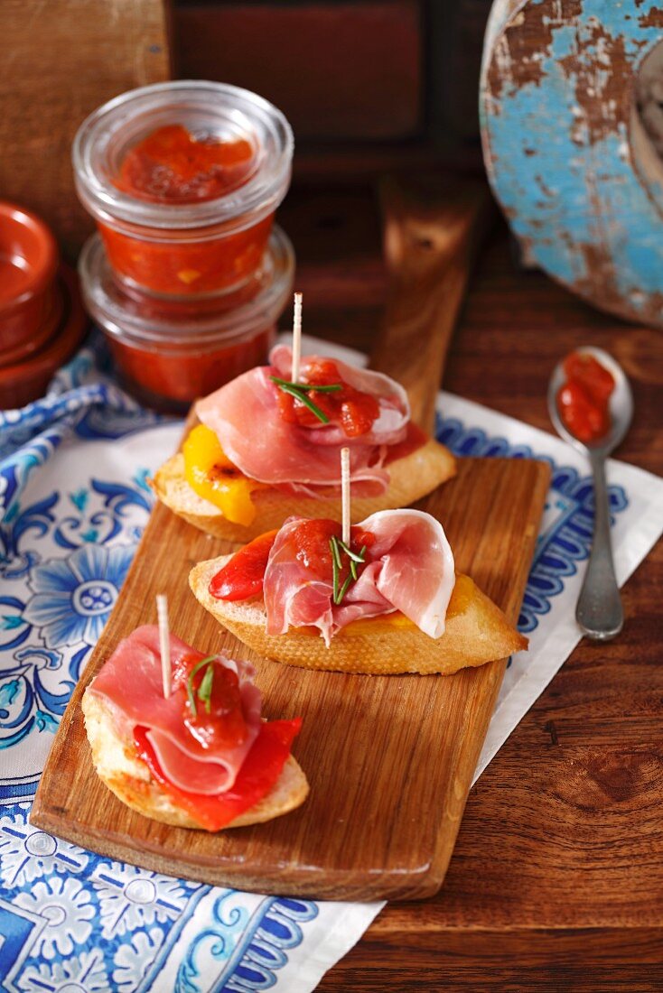 Baguette with Serrano ham, grilled peppers and tomato salsa