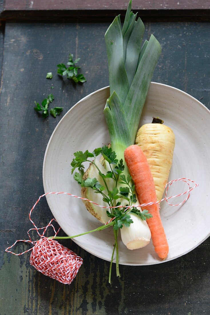 Soup vegetables tied with kitchen twine