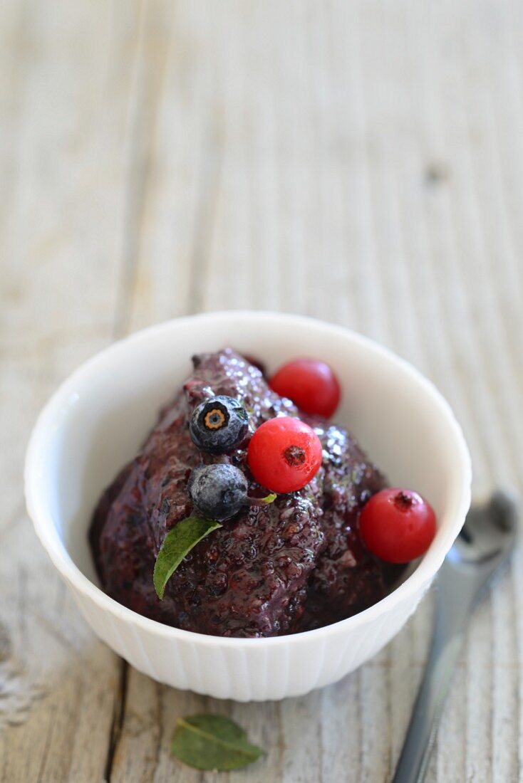 Blackberry cream with blueberries and redcurrants