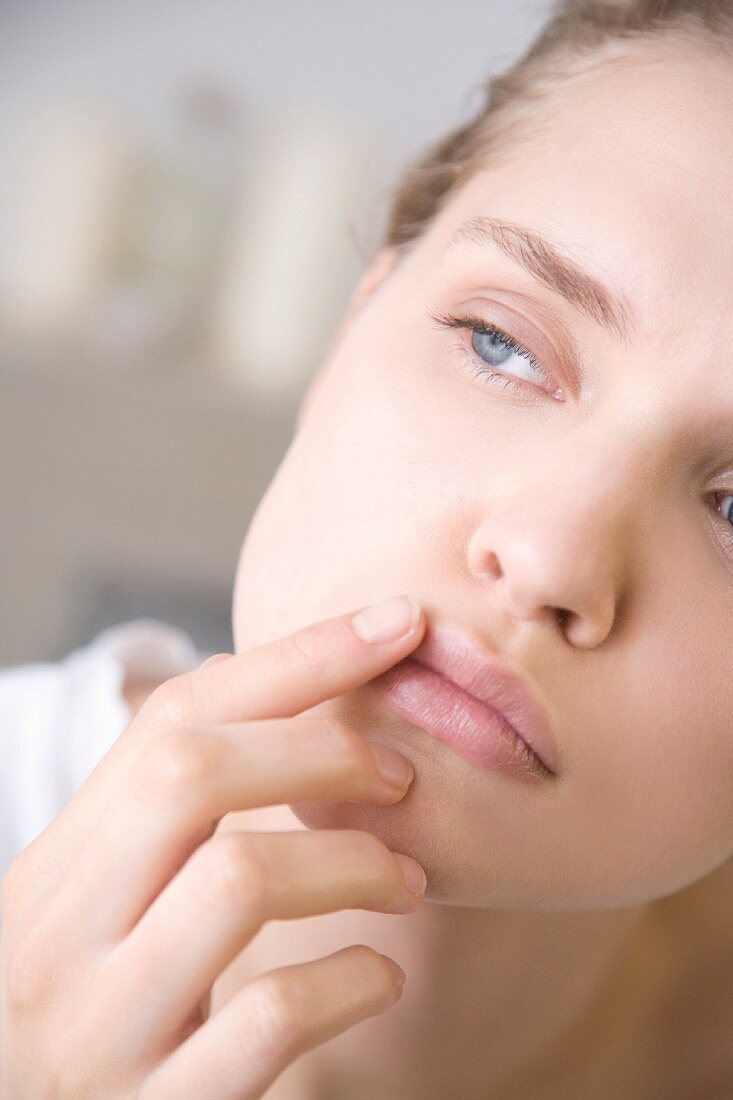 Woman applying lip balm