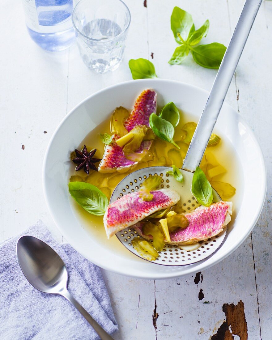 Oriental-style red mullet fillets in ginger broth