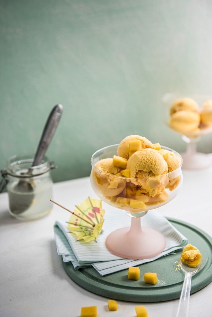Mango ice cream with an ice cream scoop
