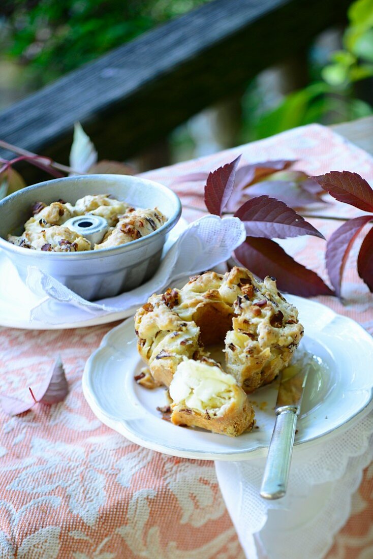 Mini chicory Bundt cakes with bacon on an autumnal table outside