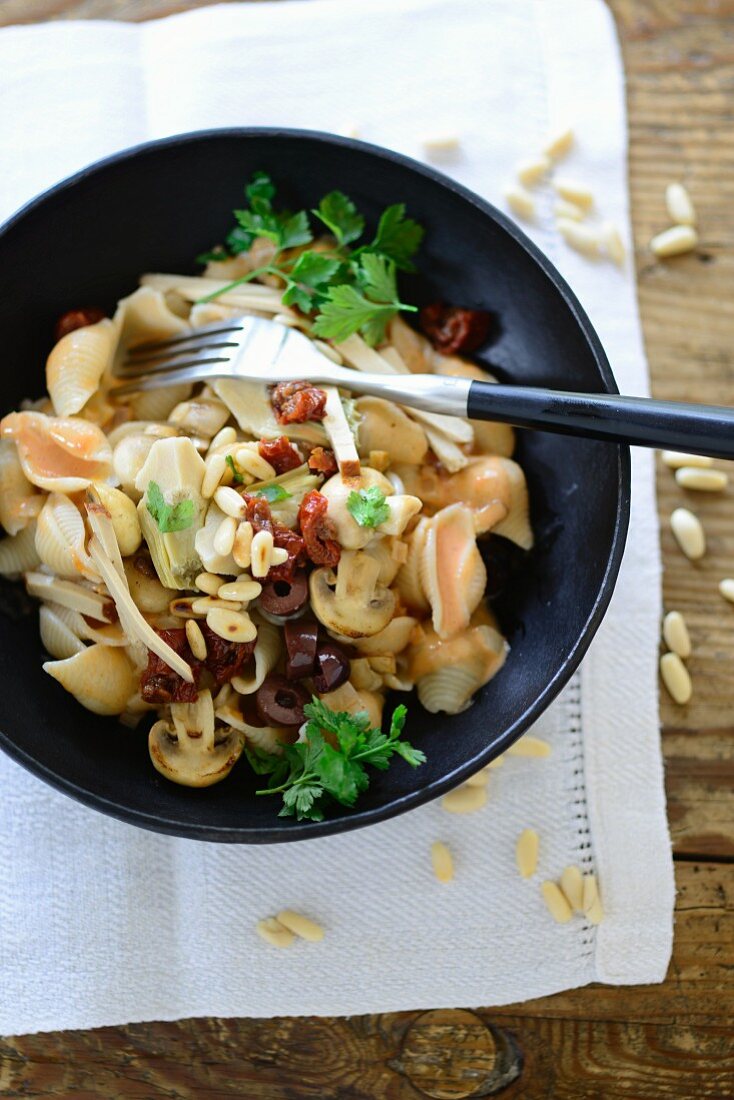 Pasta Valentino (pasta with artichokes, olives, mushrooms and pine nuts, Italy)