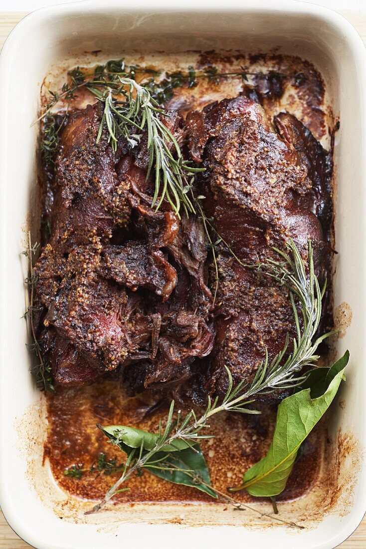 Slow cooked lamb with rosemary and bay leaves