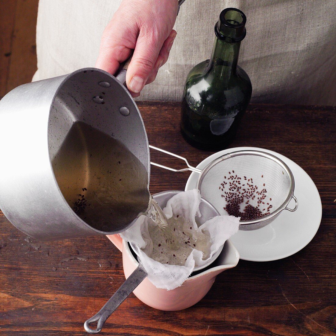 Psyllium wine à la Hildegard von Bingen being sieved