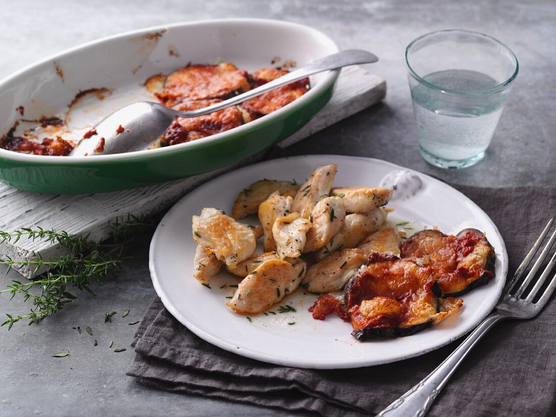 Fried chicken strips with gratinated aubergines