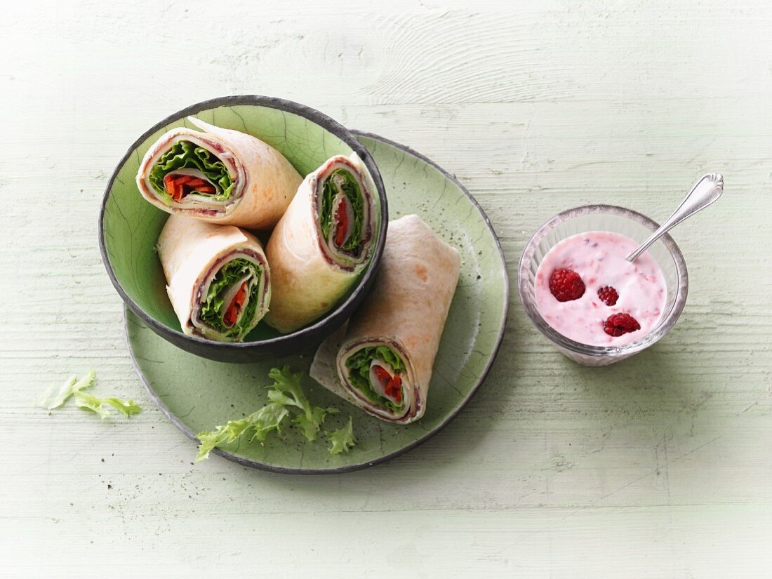 Ham and cheese wraps with vegetables and raspberry yoghurt