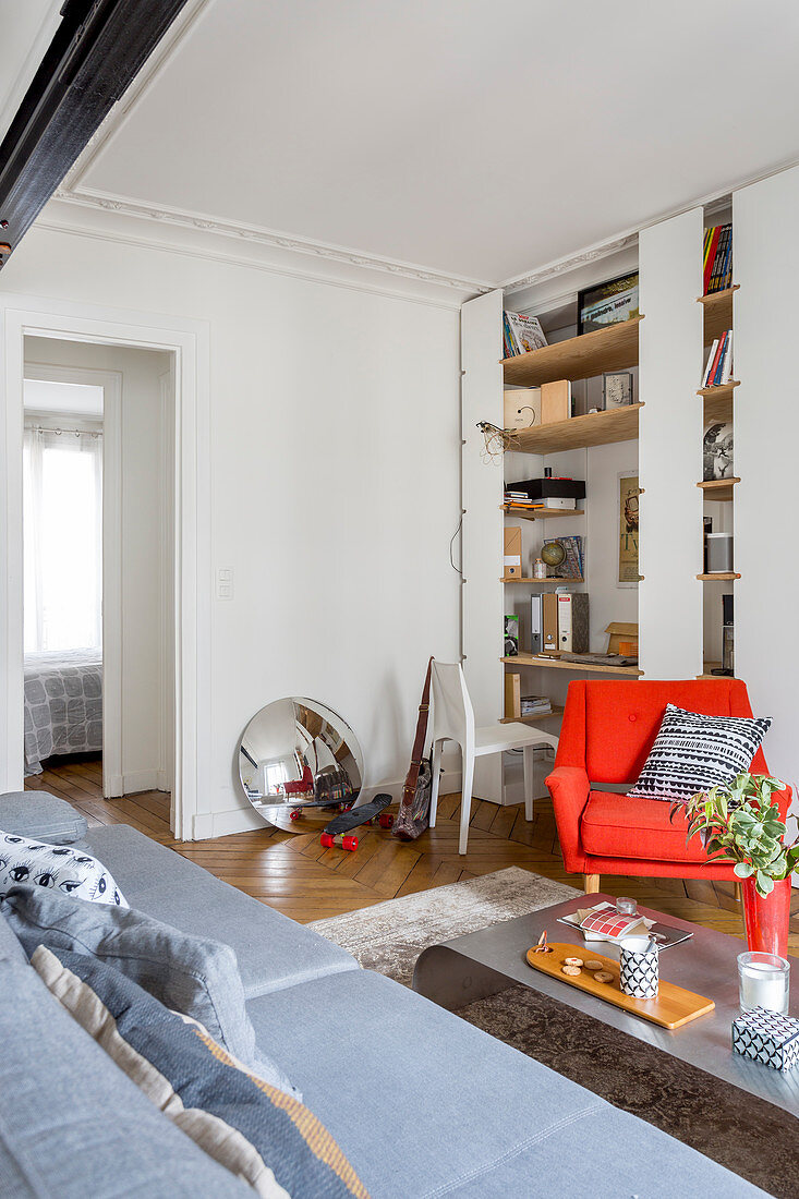 Shelving with integrated desk in living room of period apartment