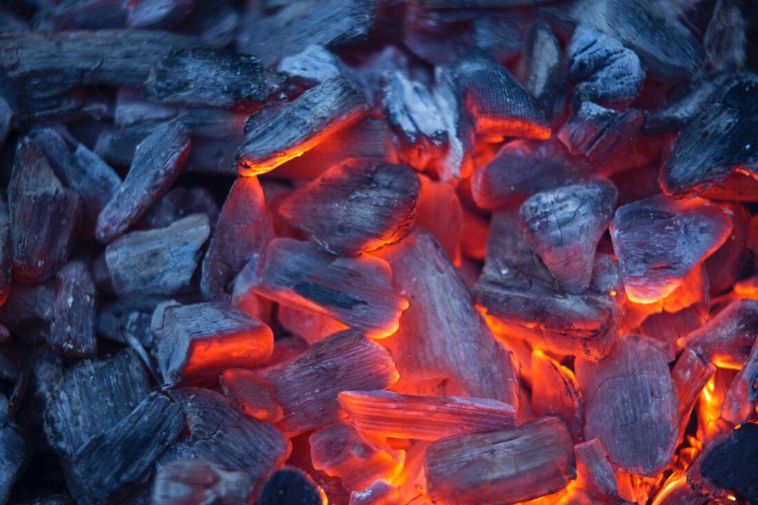 A grilling fire with glowing charcoal