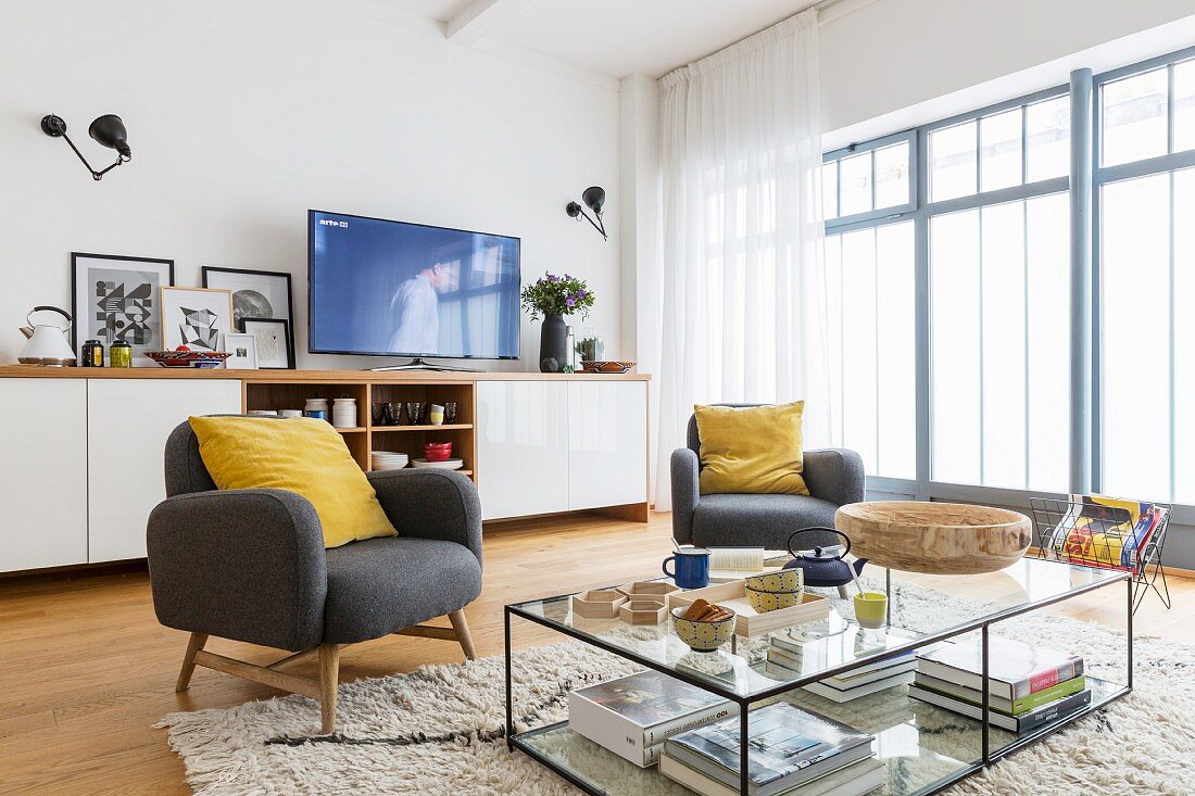 Glass table and long sideboard in modern living room