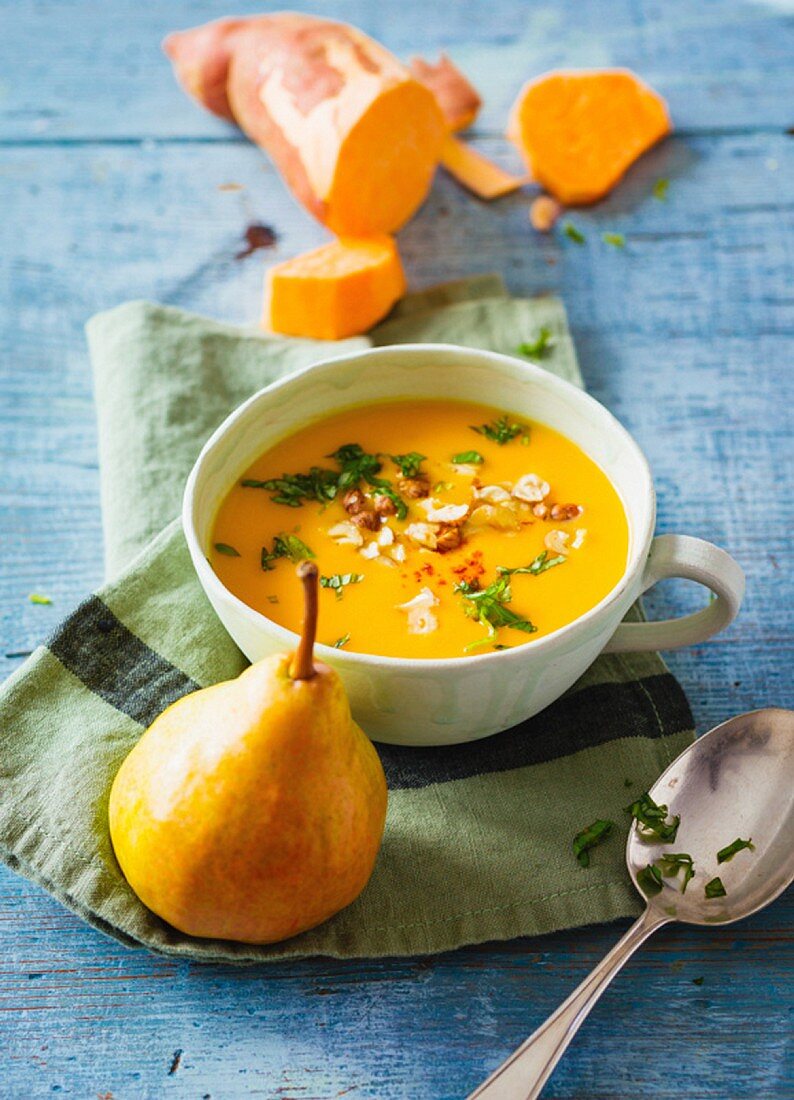 Sweet potato soup with pears and hazelnuts