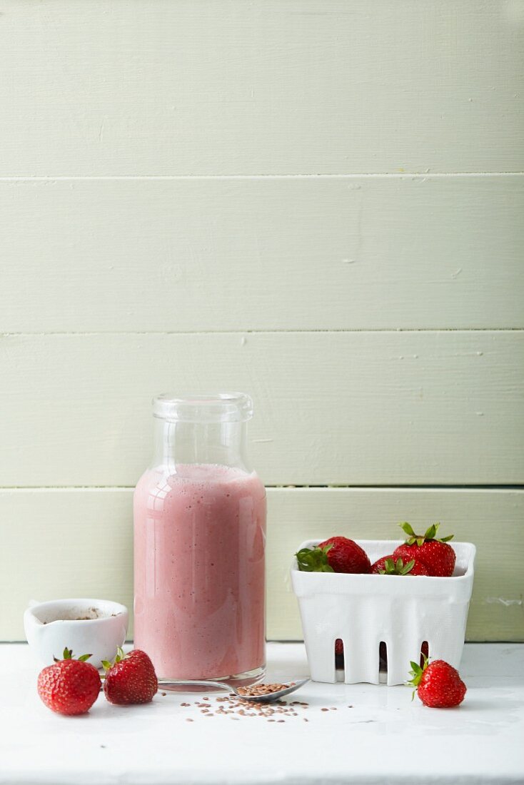 A strawberry smoothie with banana and flaxseeds