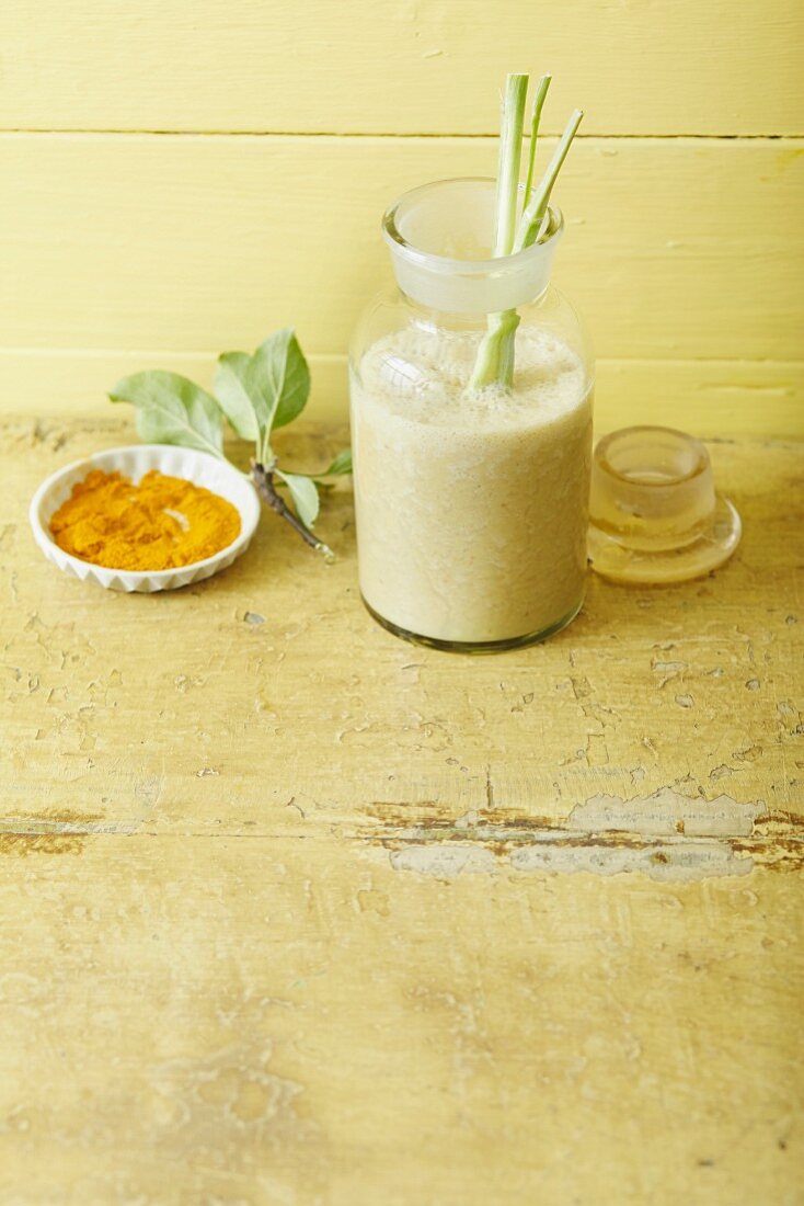 An apple and banana smoothie with almond milk, lemongrass and turmeric