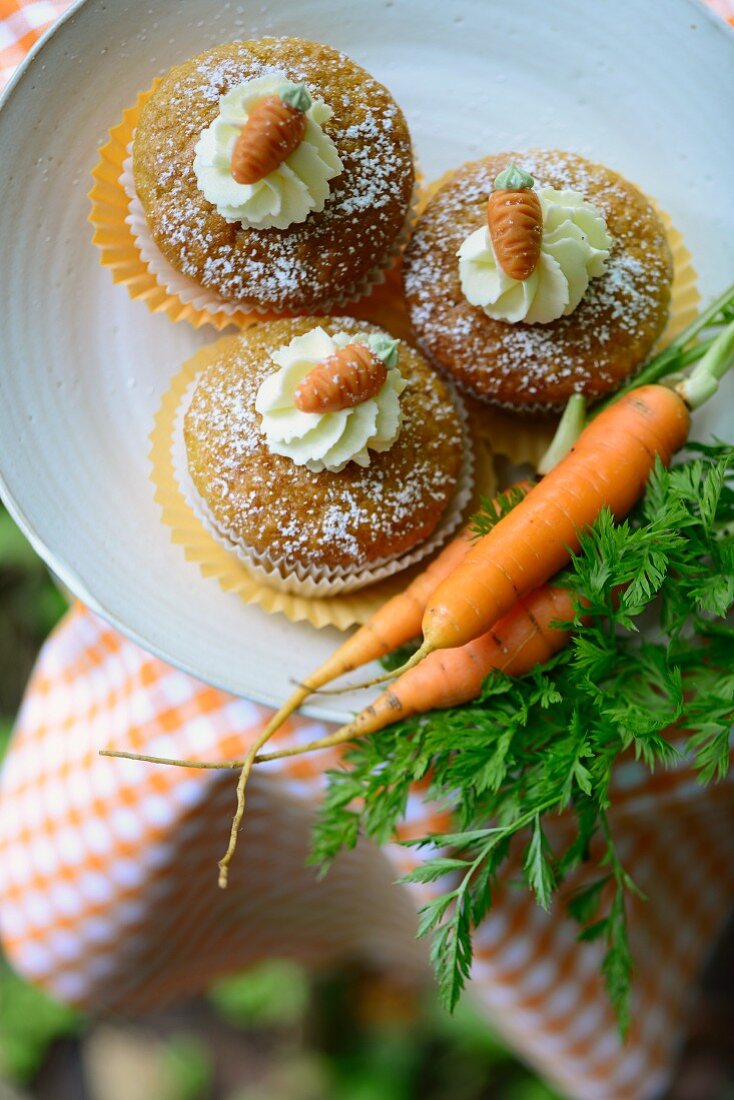 Carrot cupcakes with marzipan decorations