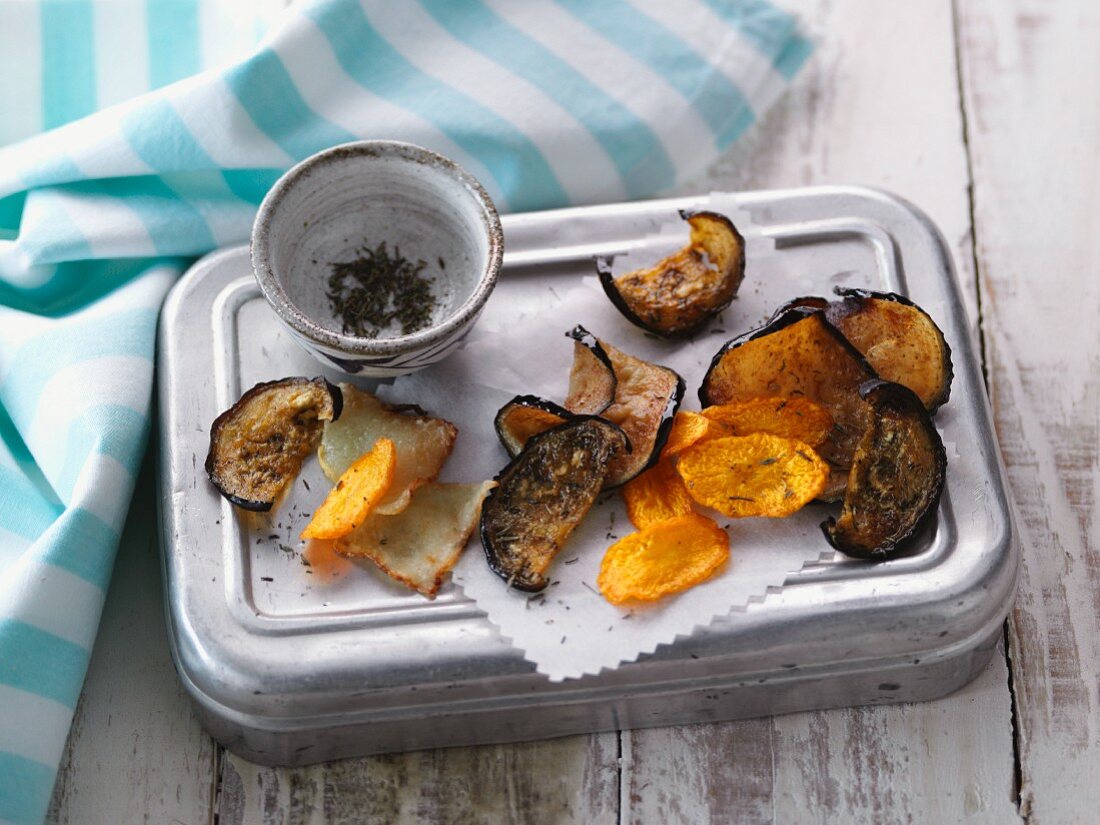 Homemade vegetable crisps made from aubergines, Jerusalem artichokes and carrots