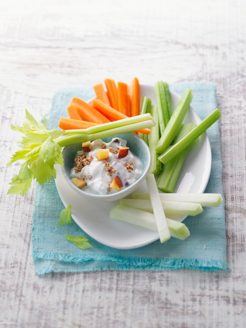 Colourful vegetable sticks with a peach and ricotta dip