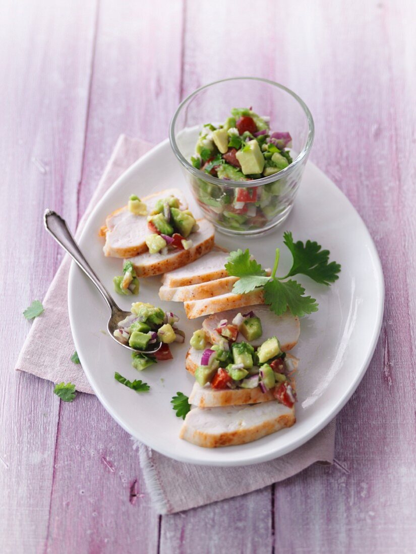 Roasted chicken breast with avocado and tomato salsa