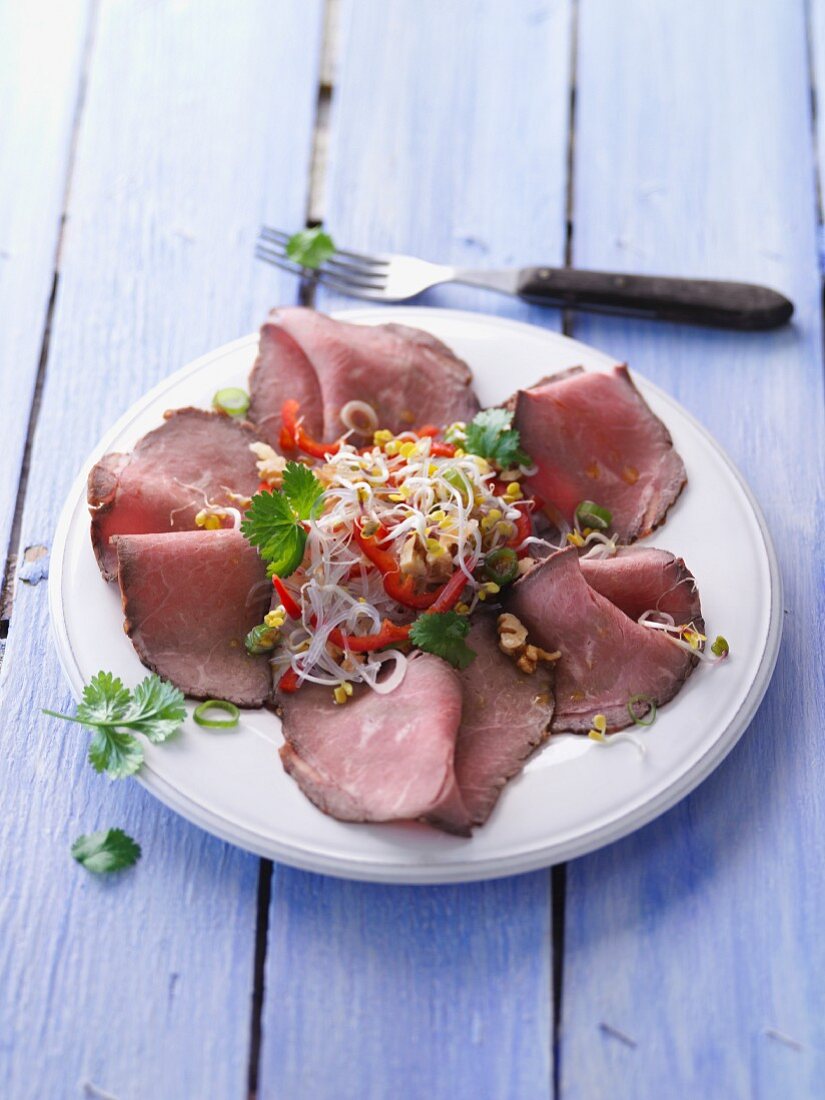 Roast beef carpaccio with a glass noodle and bean sprout salad