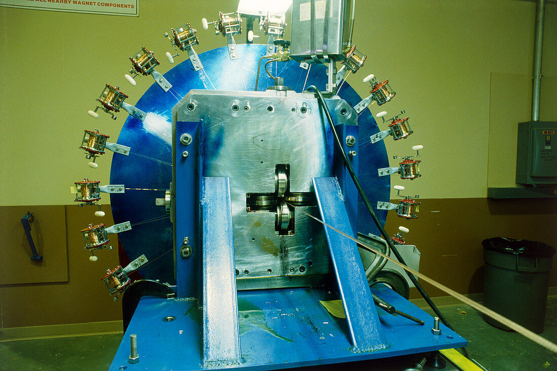 Apparatus to make superconducting magnets