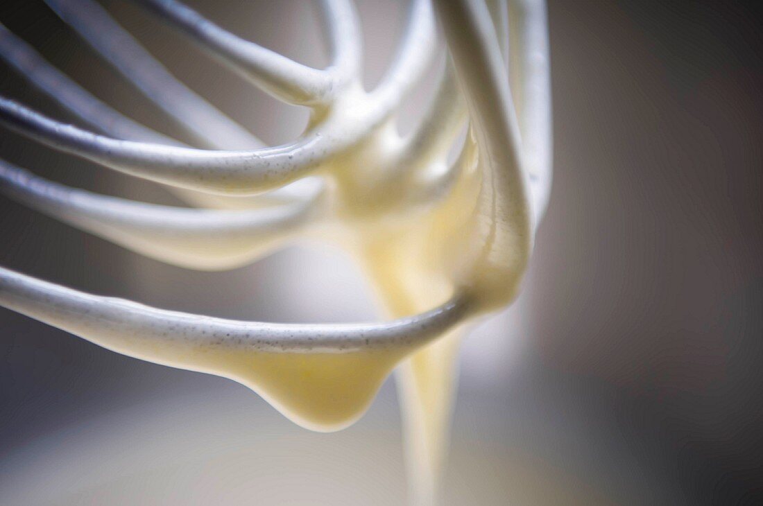 A close up of batter on a whisk