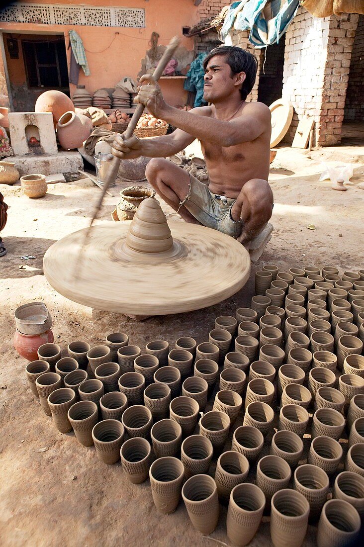 Throwing pots,India