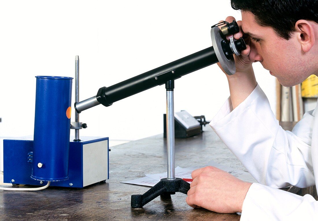 Student using a chemical polarimeter