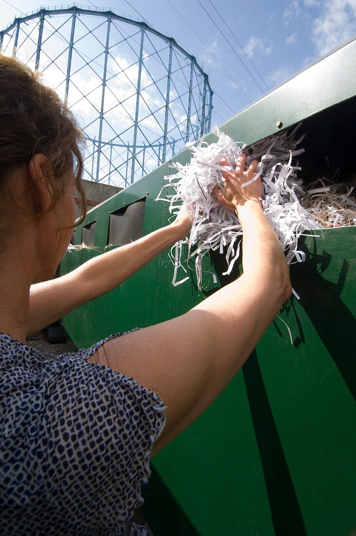 Woman recycling paper