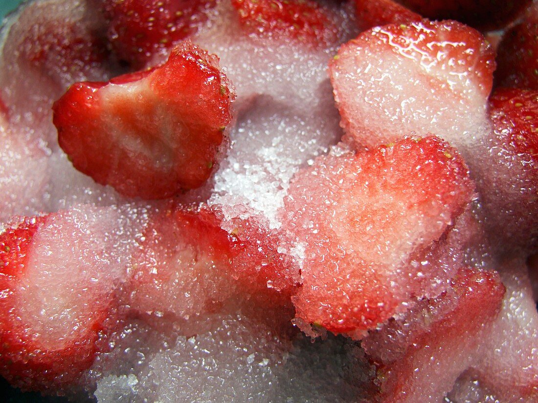 Sliced strawberries covered with sugar