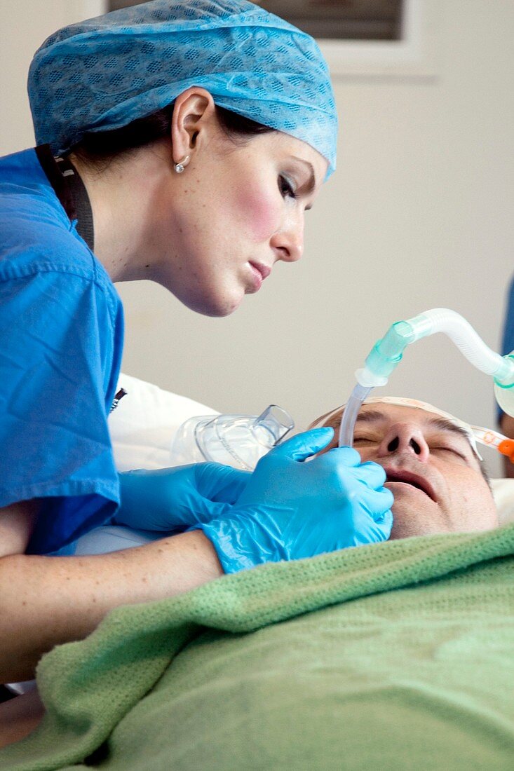 Anaesthetist checking a patient