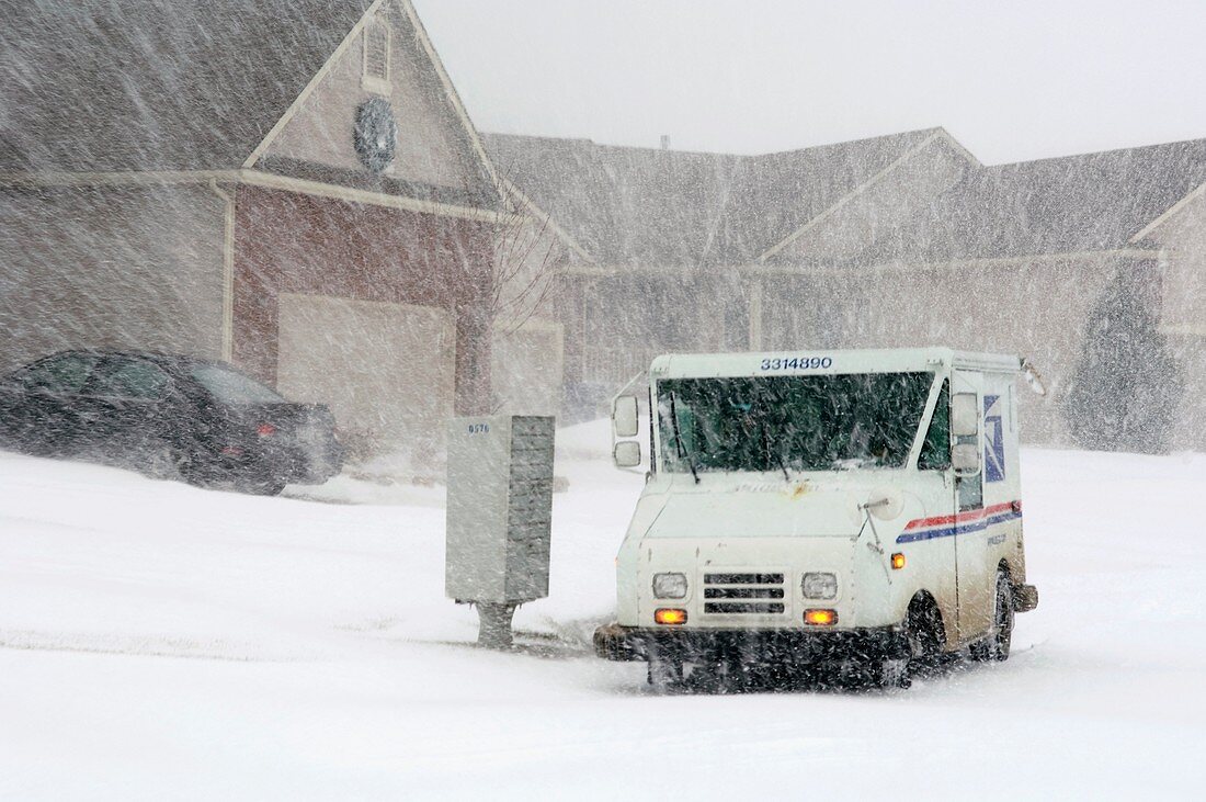U.S. Mail truck in heavy snow
