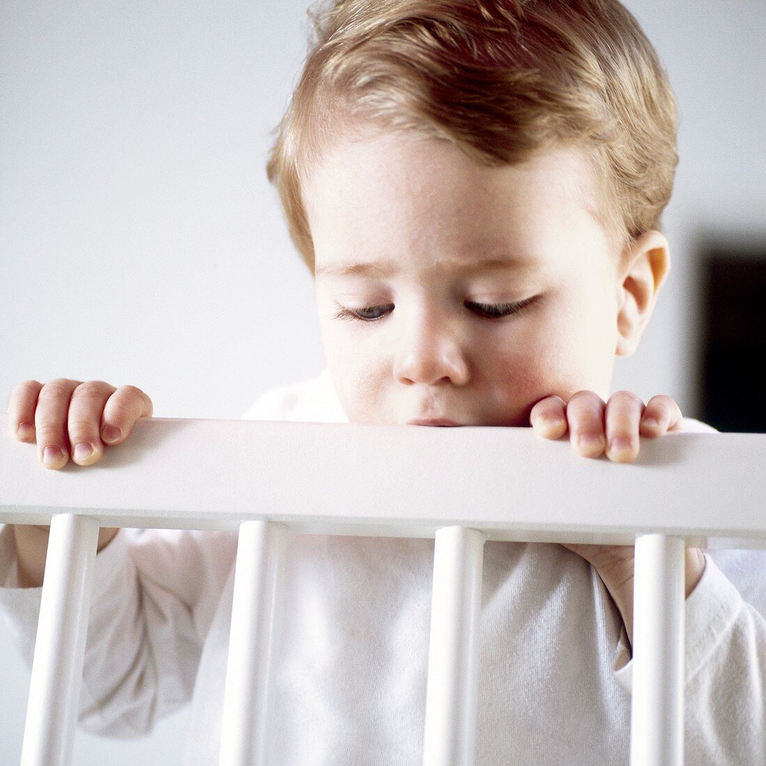 Toddler in his cot