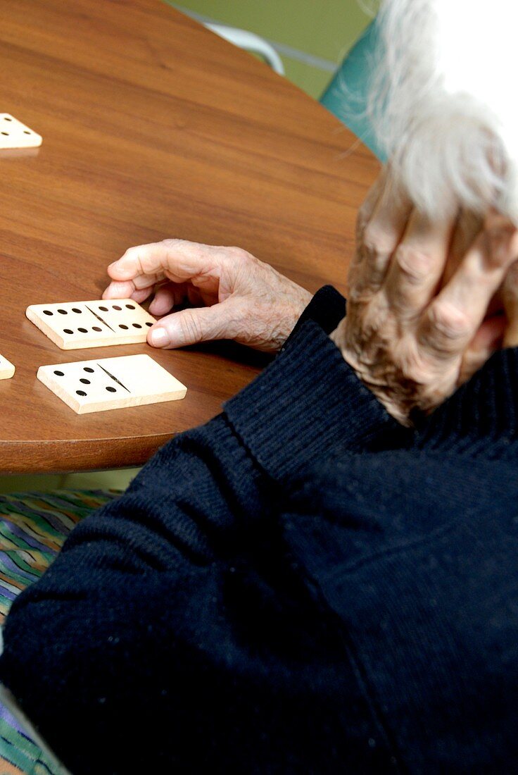 Alzheimer's patient plays dominoes