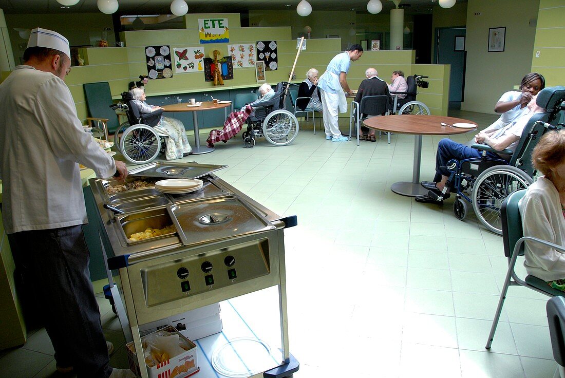 Alzheimer's patients eating in a care hom