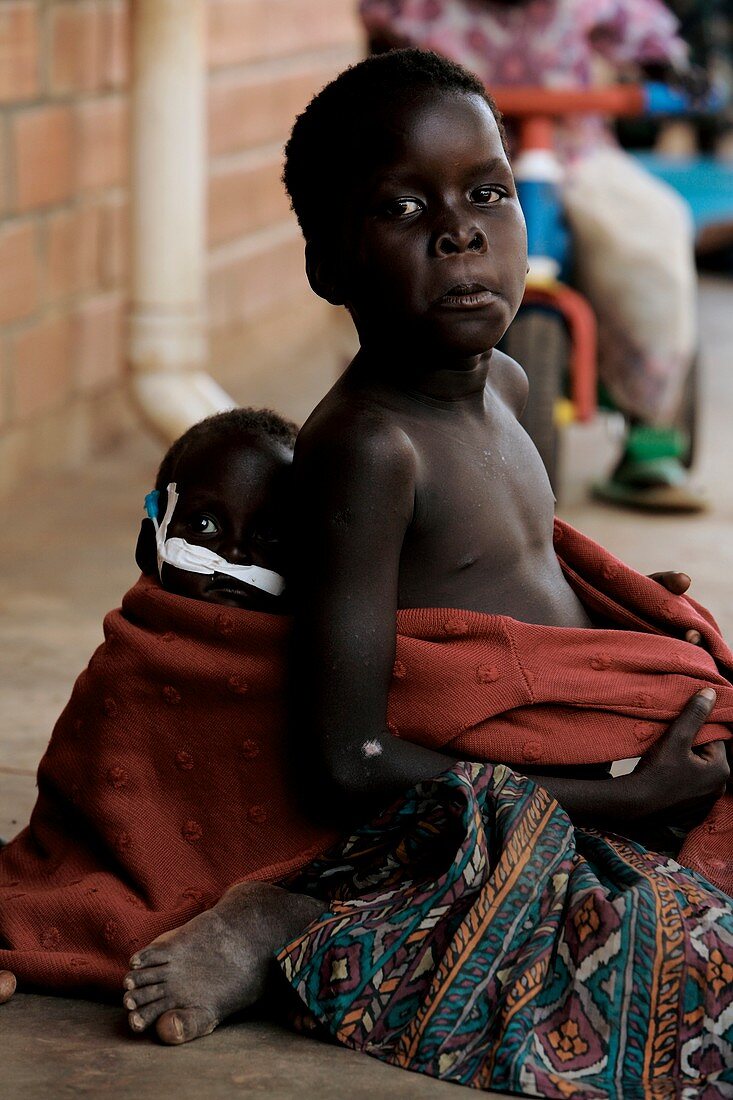Boy carrying a baby,Uganda