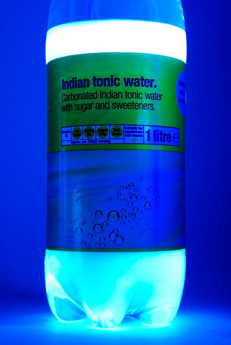 Tonic water bottle in UV light