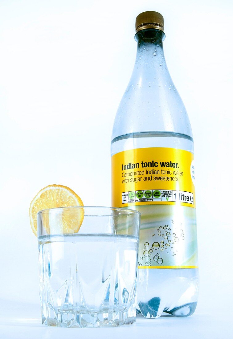 Tonic water bottle and glass