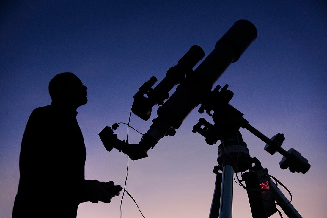 Observer setting up a telescope