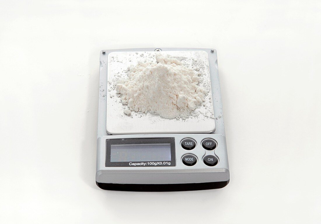 White powder being weighed
