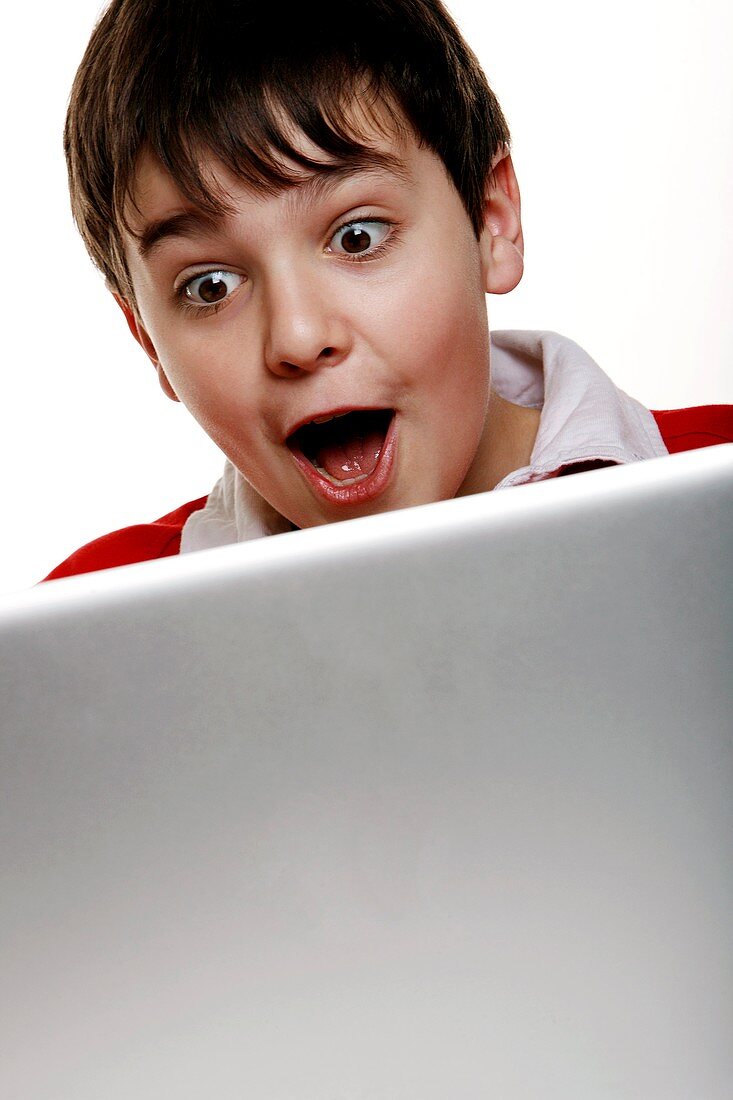 Boy using a laptop computer