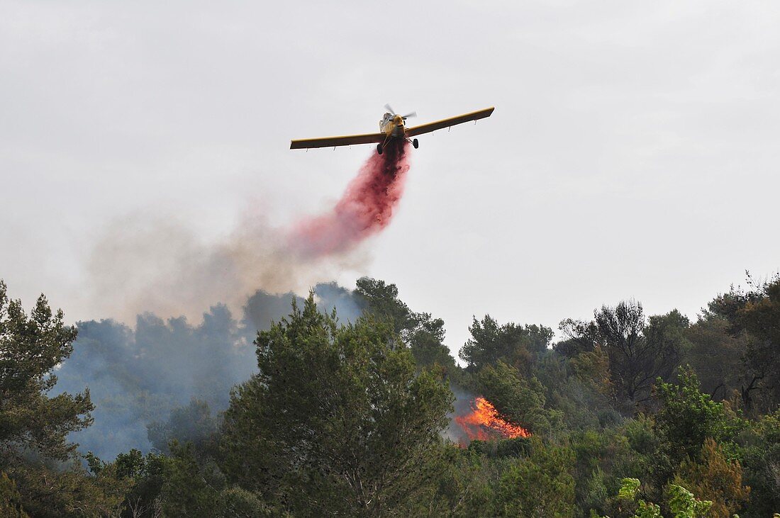 Aircraft drops fire retardant